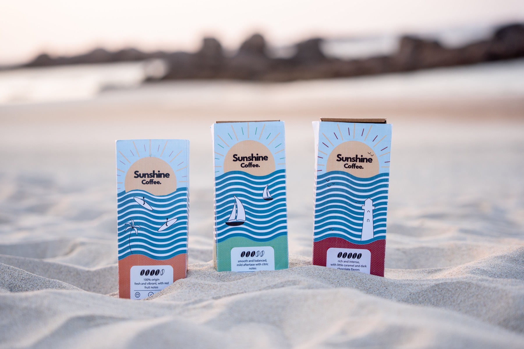Sunshine Coffee capsule boxes on the beach